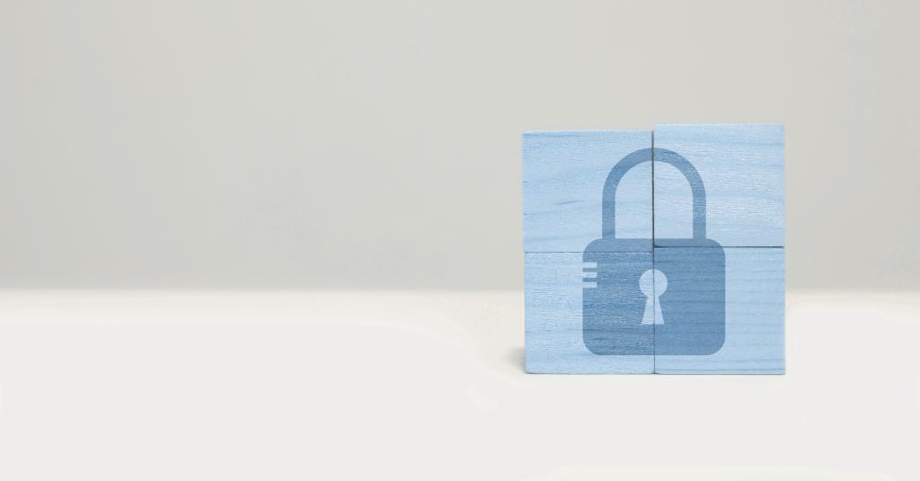 Klossar med illustration på ett hänglås